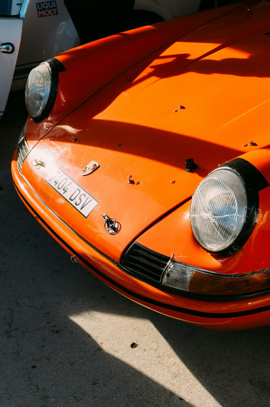 Orange vintage sports car close up front view
