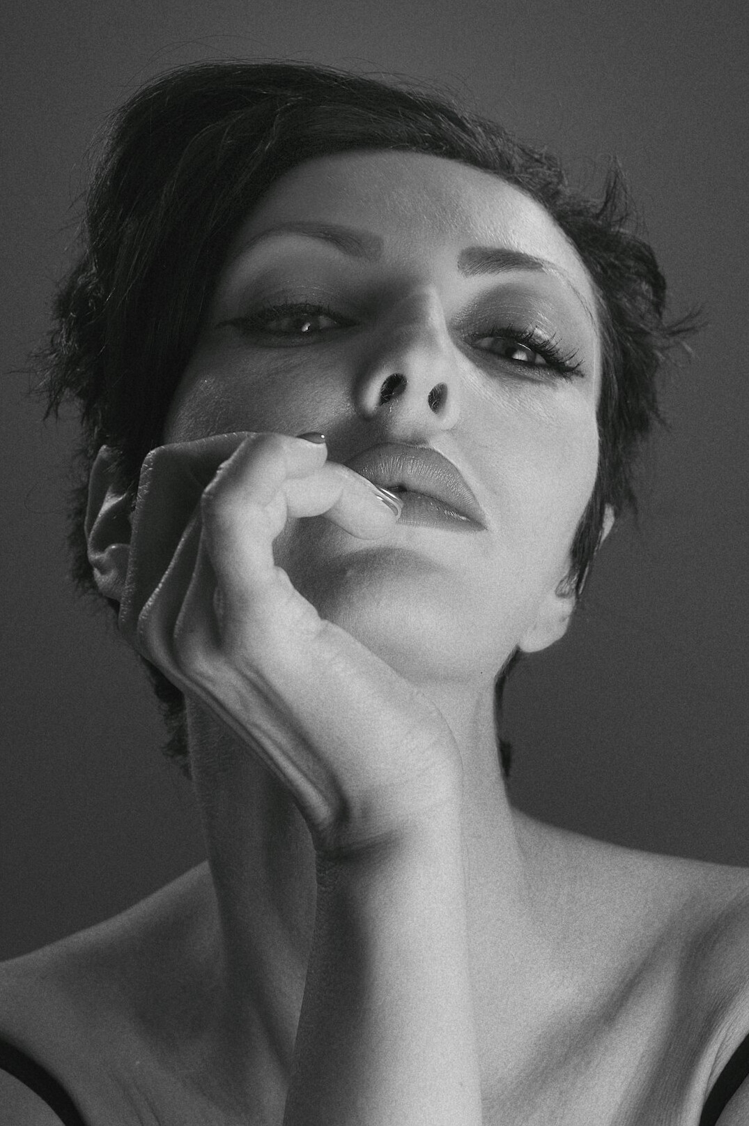 Studio portrait of a woman with short dark hair