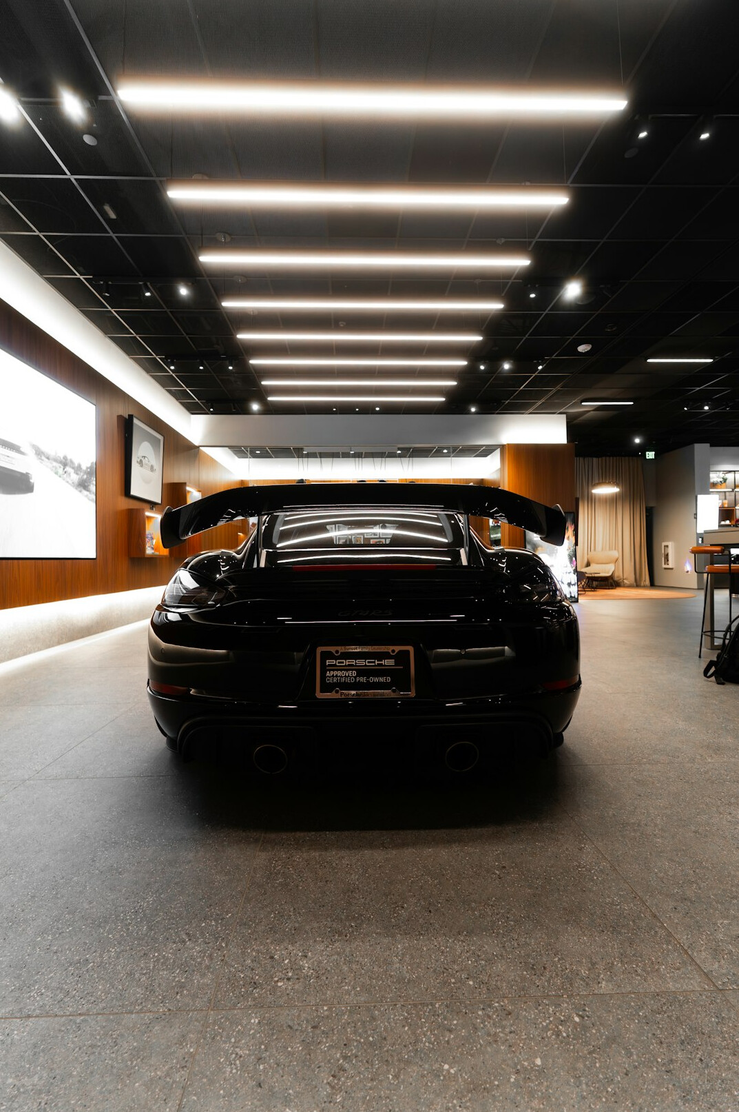 Luxury car showroom with dramatic lighting