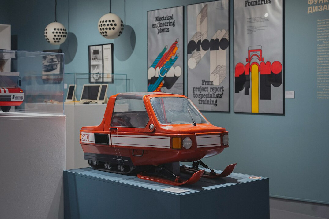 Vintage red car parked in an elegant exhibition hall