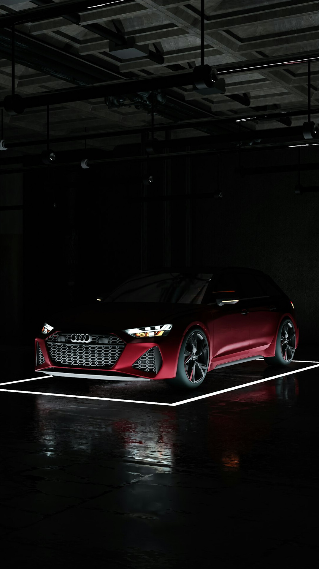 Dark automobile showroom with a single spotlighted car