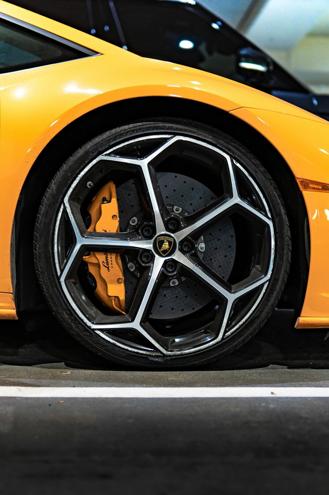 Modern supercar wheel and carbon fiber detail