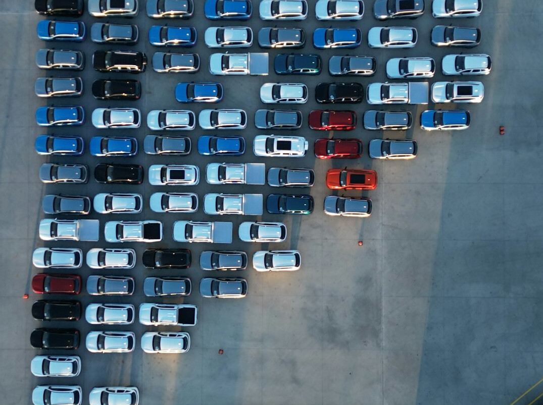 person choosing car at lot